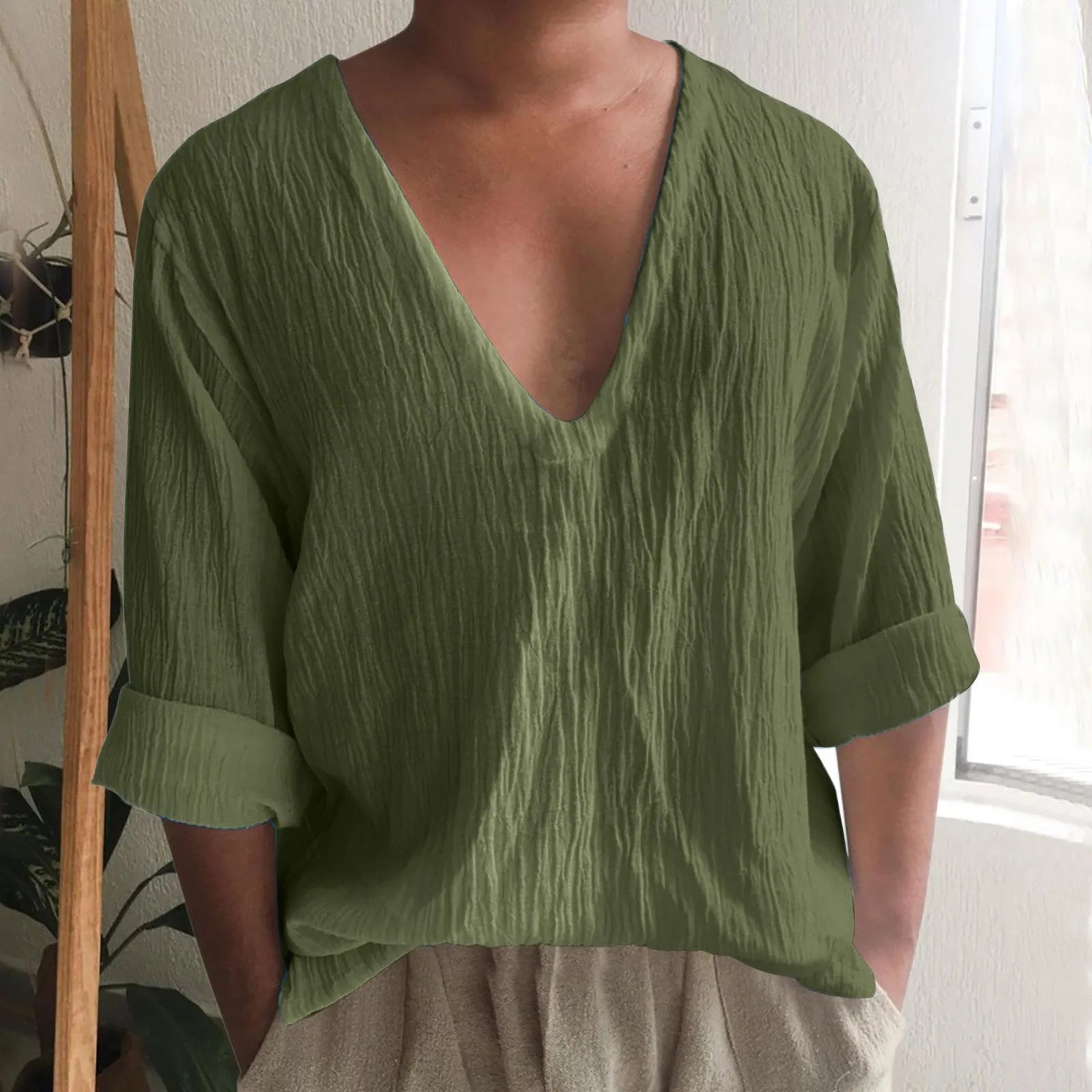 Men's long sleeve V-neck t-shirt in washed cotton, shown in a solid colour.