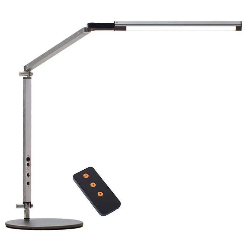 Adjustable aluminium desk lamp with remote control, shown in black with a clip attached to a desk edge.