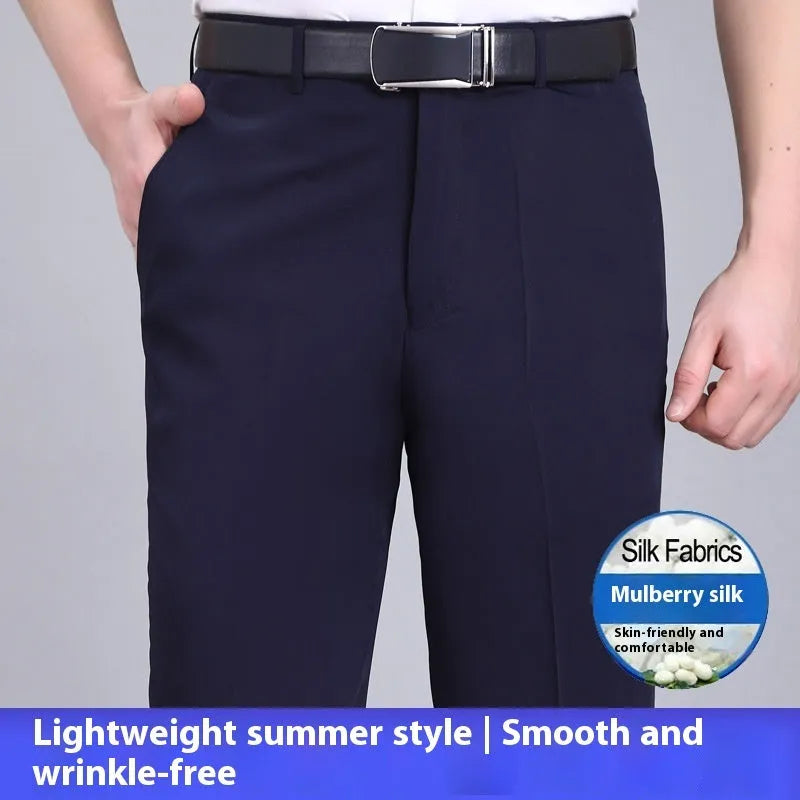 Man wearing dark blue straight-leg non-iron business trousers with a mulberry silk blend fabric.