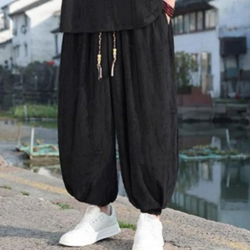 Men's thin knit two-piece suit with half-sleeve top and cropped trousers in black or grey colour options
