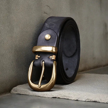 Men's black cattlehide leather jeans belt with a copper pin buckle shown on a flat surface.