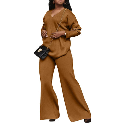 Women's brown suede two-piece suit with split sleeves on top and matching trousers
