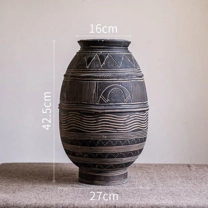 Medium cement African Ancient Tank style flower pot with a textured finish and drainage hole.