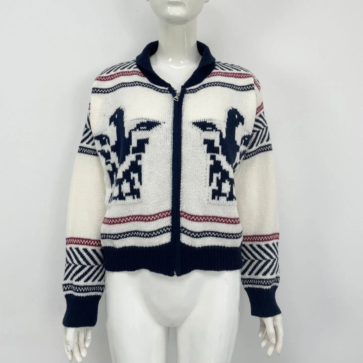 White women's wool zipper cardigan with contrasting jacquard stripe pattern on the front.