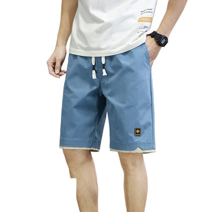 South Korea style loose straight-leg beach shorts in khaki on a plain background