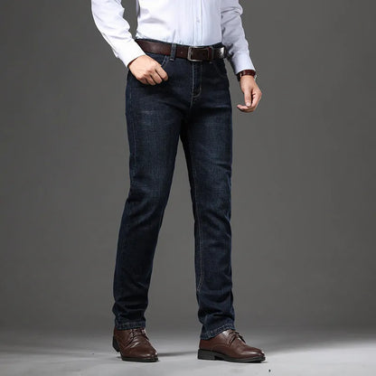 Men's straight-leg stretch jeans in black or blue denim with a zip fly, shown laid flat.