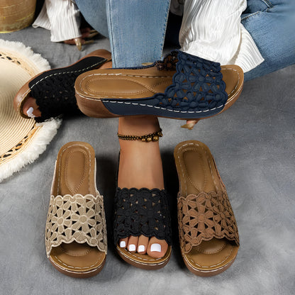 Women's wedge beach slippers with flower cutout design on PVC upper, shown in light brown colour.