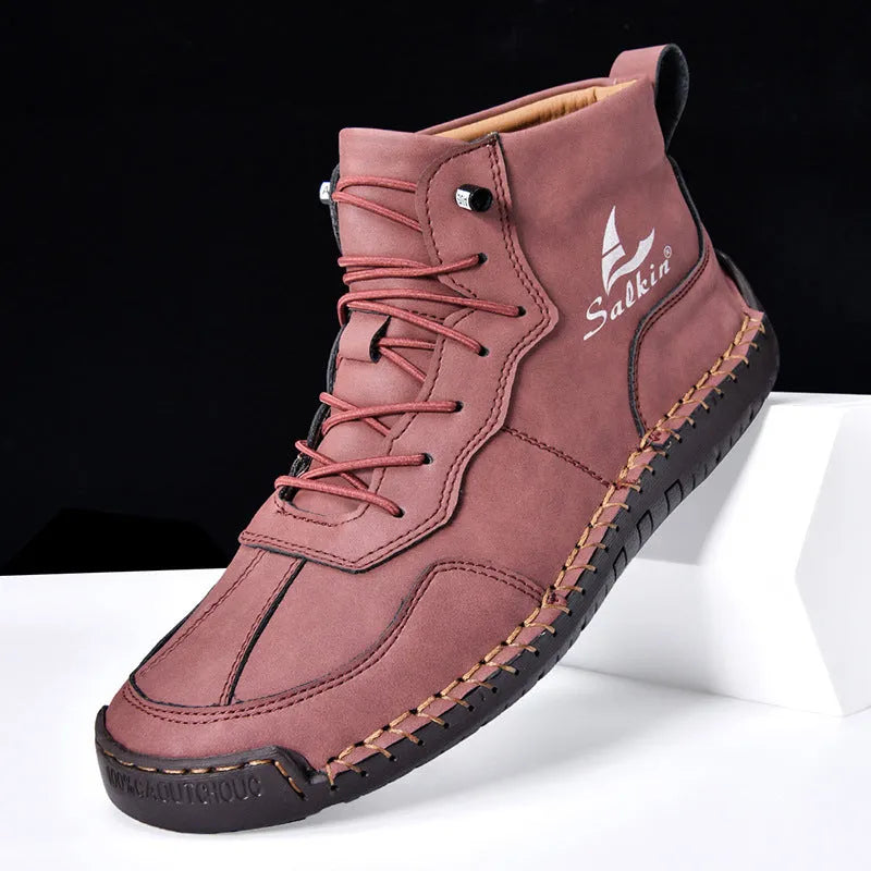 A pair of beige high-top casual boots with elastic band fastening and a flat rubber sole.