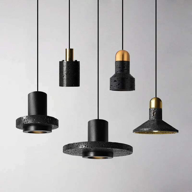 Industrial style iron chandelier with an adjustable hanging cord above a dining table.