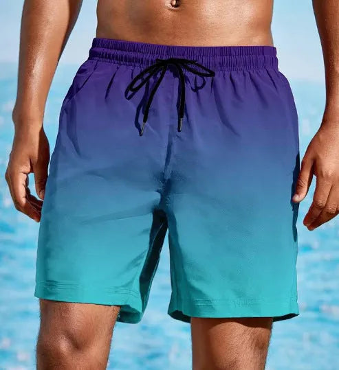 Men's grey gradient print sports shorts made from breathable mesh fabric, shown on a model.