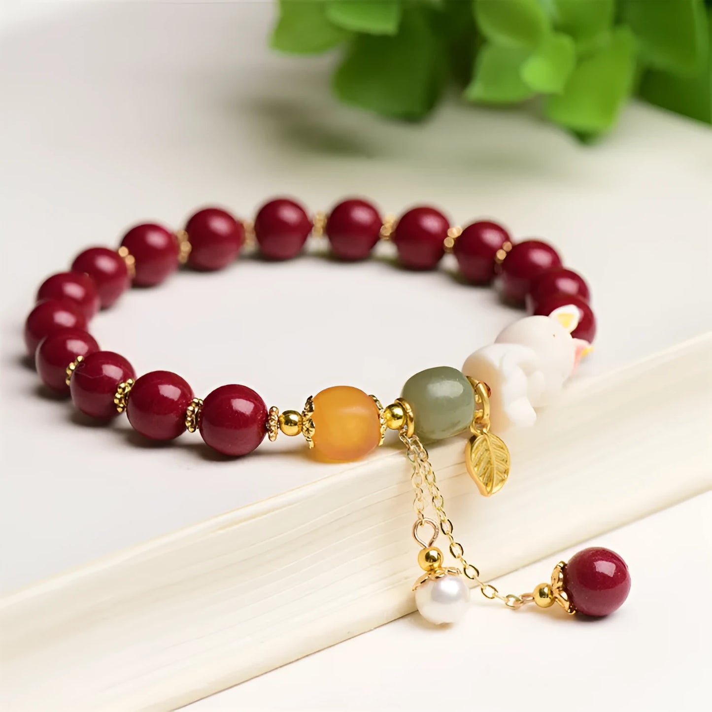 Traditional Chinese cinnabar bracelet with bunny design in purple-gold sand colour