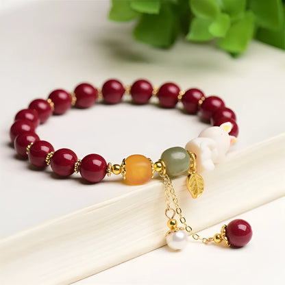 Traditional Chinese cinnabar bracelet with bunny design in purple-gold sand colour