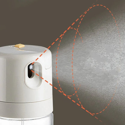 Warm grey glass oil sprayer bottle with a switchable nozzle for spray or pour modes.