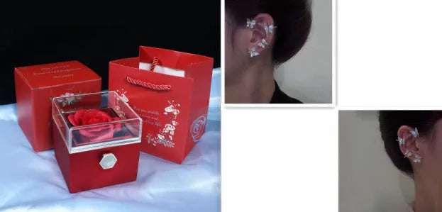 Rotating rose jewellery gift box with a preserved red rose under a clear acrylic dome, showing the interior rotating drawer.