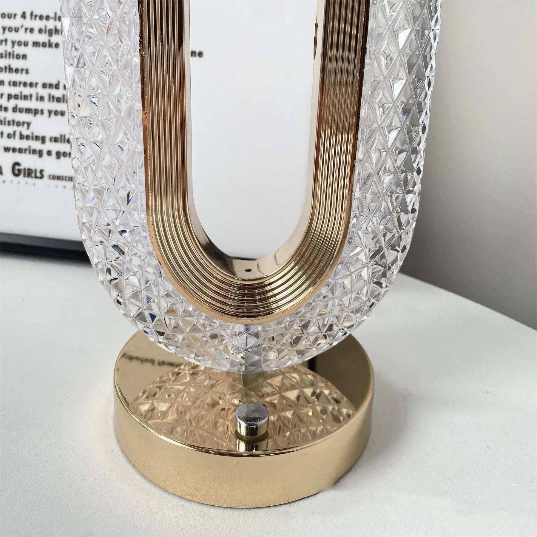 Modern minimalist O-shaped crystal desk lamp with touch dimming control on metal base