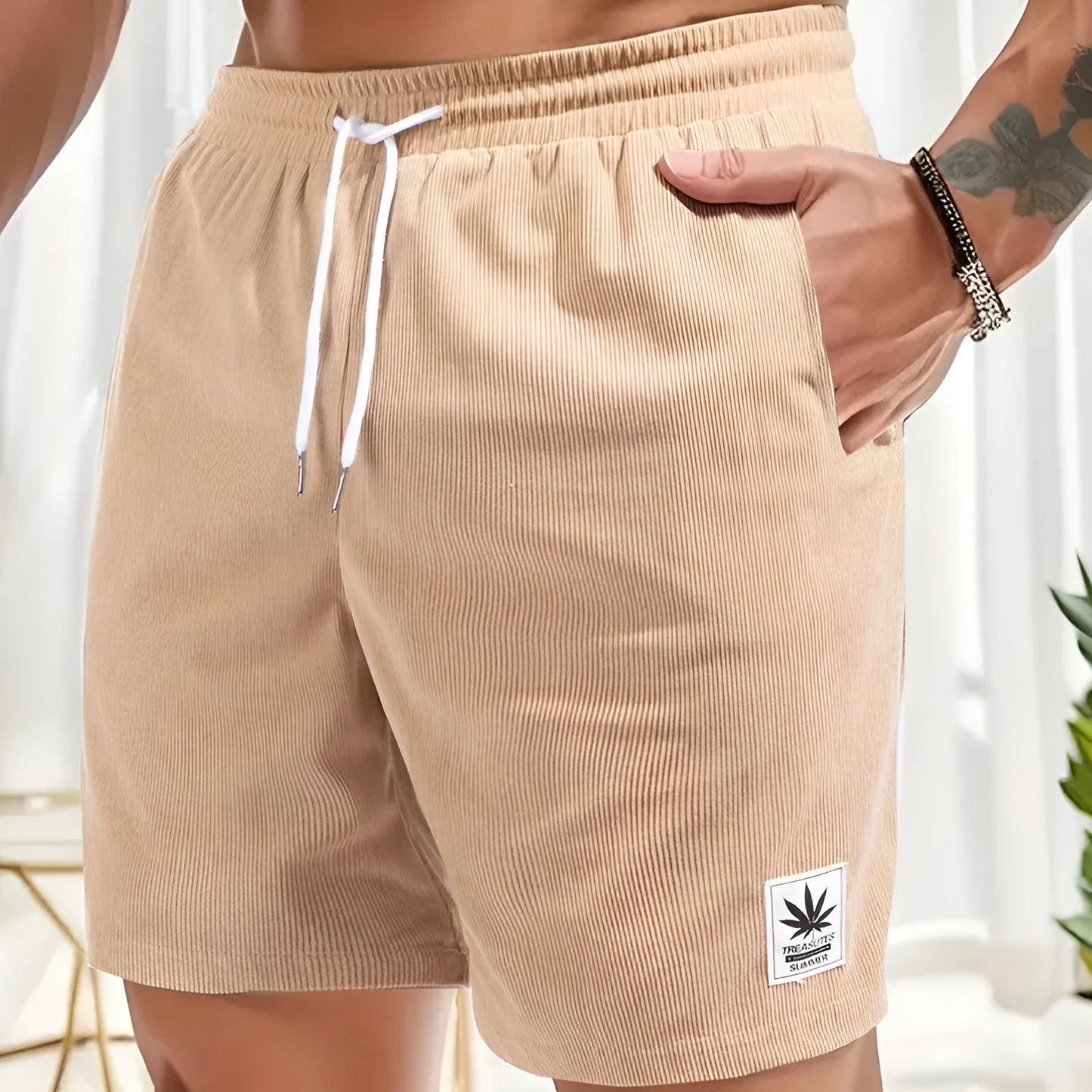 Men's straight-cut drawstring shorts in blue, shown on a model for summer casual wear.