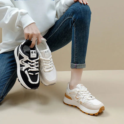 Women's black sports casual shoes with round toe and front lace-up design on a flat heel.