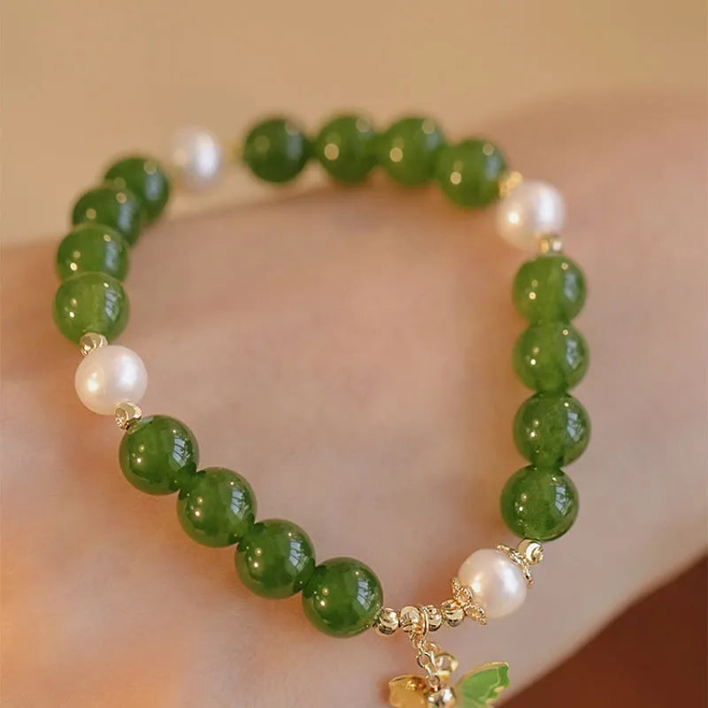 Natural green chalcedony stone bracelet with round beads in geometric arrangement