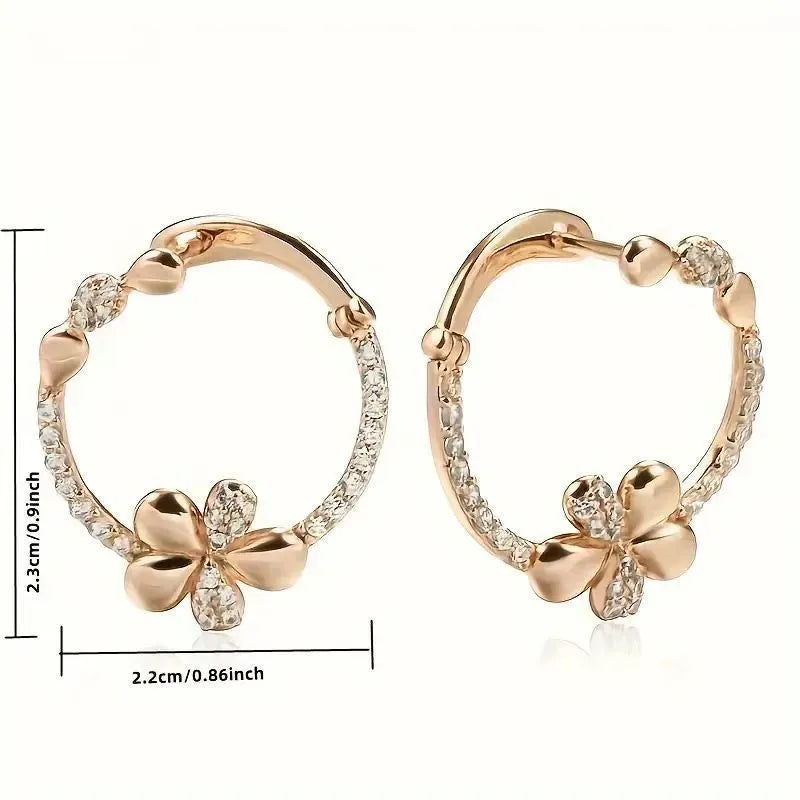 A pair of round ring earrings for women made from electroplated copper with a geometric design.