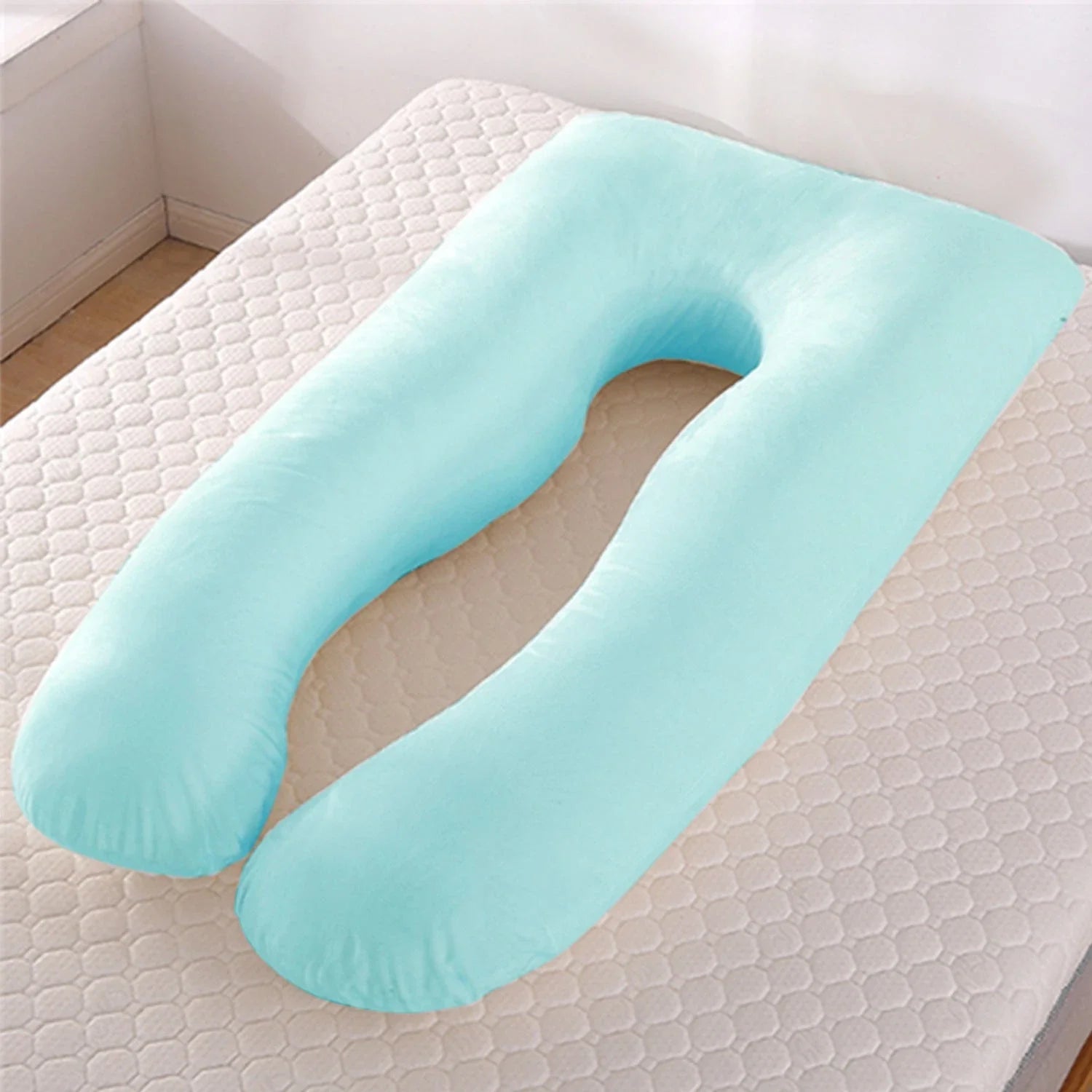 Premium U-shaped pregnancy pillow with pure cotton exterior and polyester fiber filling, designed to provide soothing support and refreshing coolness for expectant mothers.