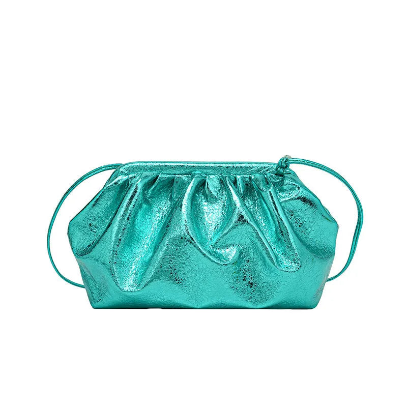 Rose red shell-shaped crossbody bag with magnetic hair clip closure and sewing line detail on the front.