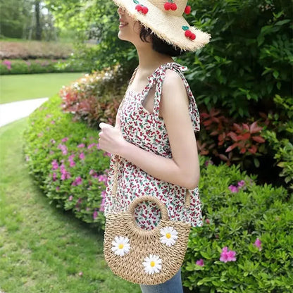 Women's light brown straw woven crossbody bag with daisy flower design showing 25x20x8 cm dimensions