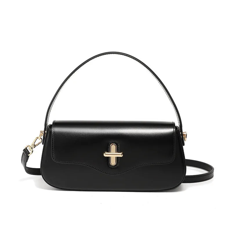 Genuine leather baguette handbag in horizontal square shape with clamshell opening and internal zip compartments