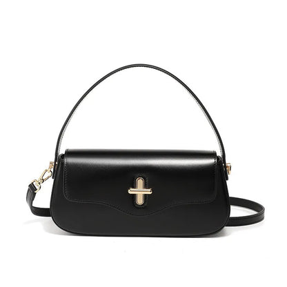 Genuine leather baguette handbag in horizontal square shape with clamshell opening and internal zip compartments