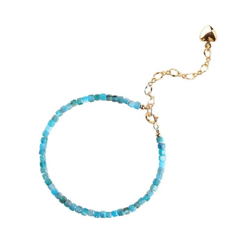 Women's blue apatite crystal bracelet with diamond-cut stones on wrist