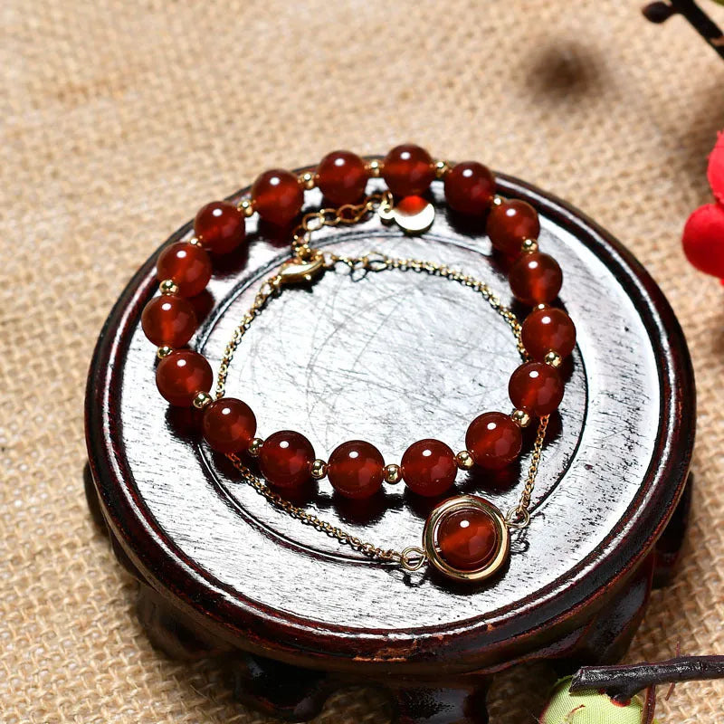 Double-layer women's bracelet with lucky beads and colourful crystals in gold-toned setting
