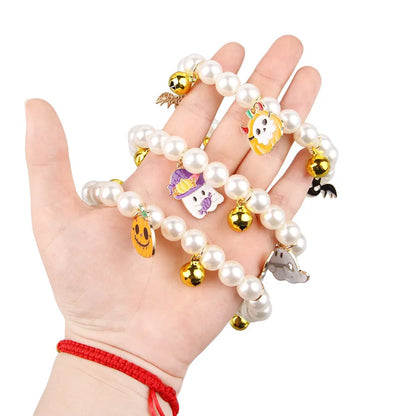 Three pearl necklaces with bells for pet Halloween costumes and decoration