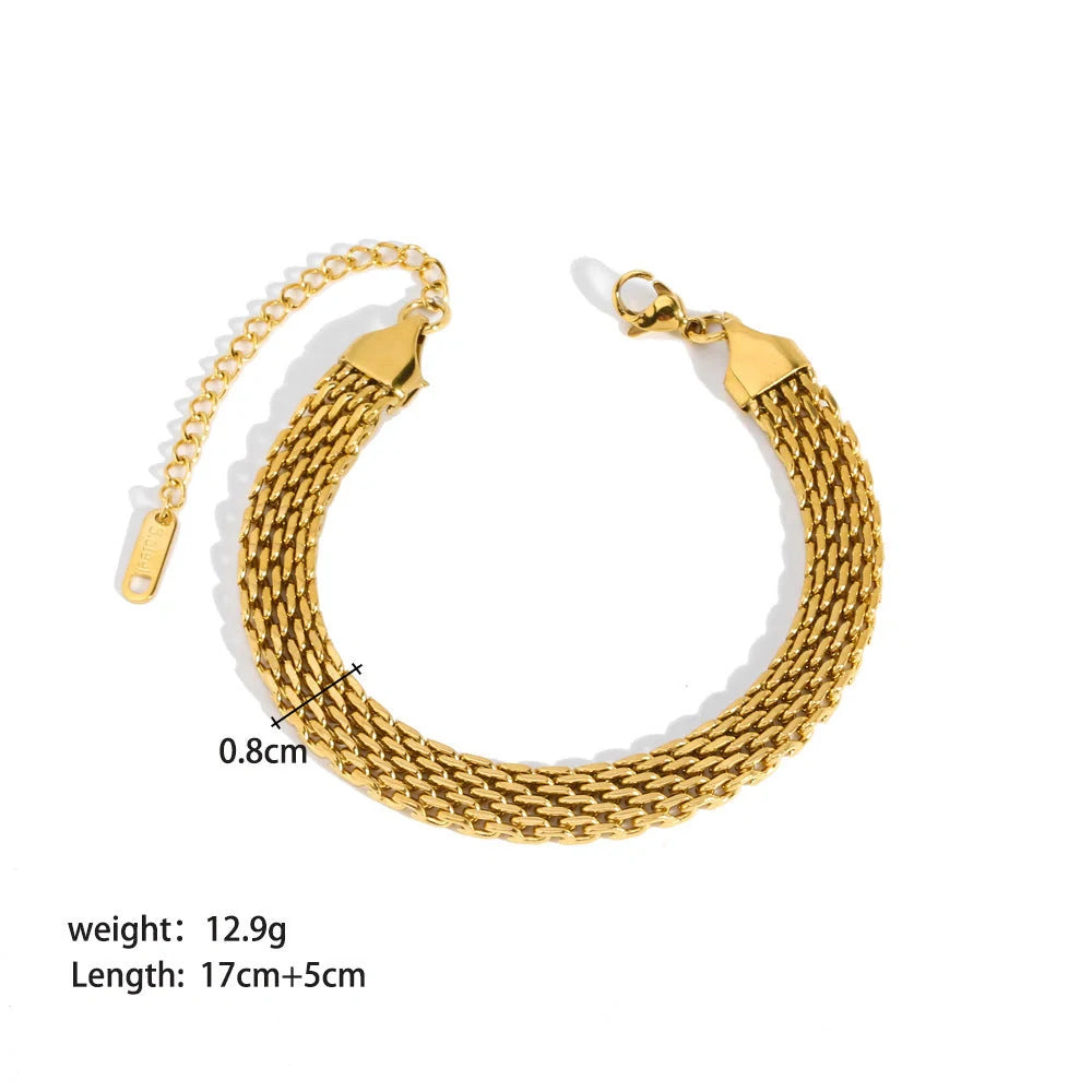 Elegant stainless steel bracelet with a sleek geometric design, gold-plated finish, and unisex style suitable for any occasion.