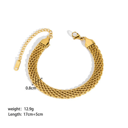 Elegant stainless steel bracelet with a sleek geometric design, gold-plated finish, and unisex style suitable for any occasion.