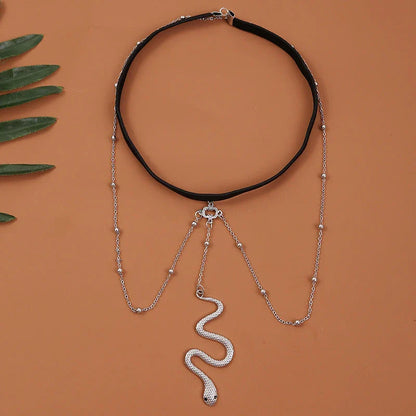Fashionable gold beaded leg chain with snake pendant for women, featuring a captivating design and adjustable fit for comfortable wear.