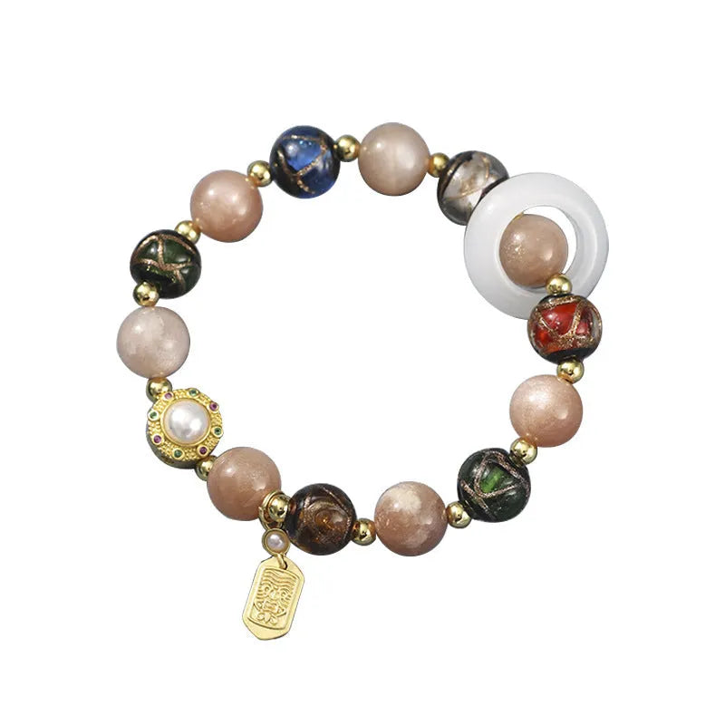 Hand-woven women's bracelet with grey coloured glaze sunstone beads and white lip shell beads