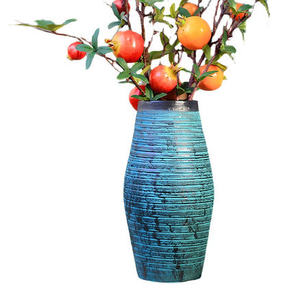 Ceramic mosaic vase with dried flower arrangement, handcrafted surface detailing