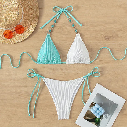 Women's colour matching swimsuit with lace-up detail and pearl chain decoration