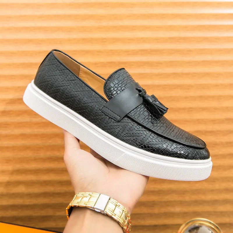 Men's black casual leather shoes with fringe detailing on round toe and low heel