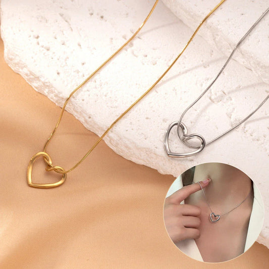 Elegant titanium steel heart pendant necklace with adjustable chain in gold and silver colors