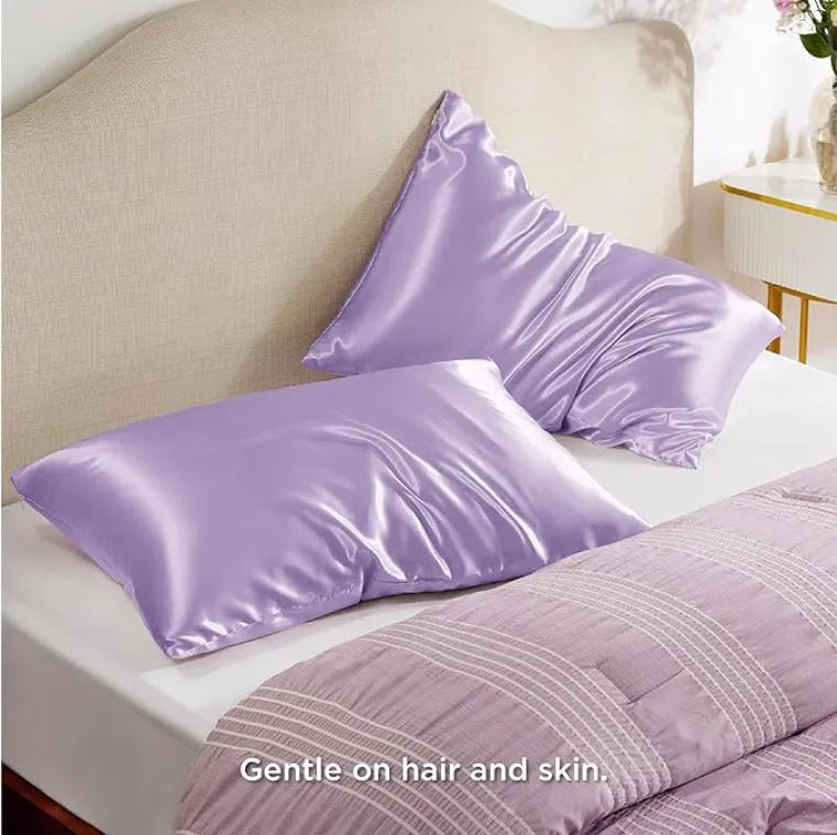 Pair of solid colour satin pillowcases showing smooth plain weave texture and reactive dye colour