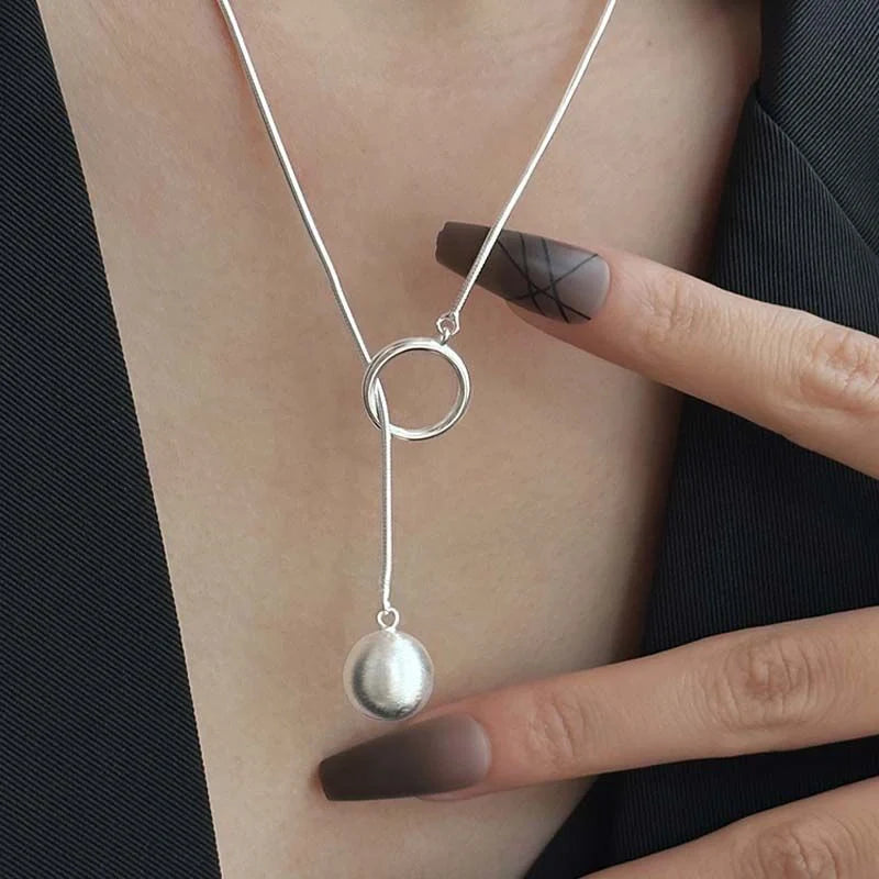 Elegant platinum-plated round ball chain necklace with sleek snake-bone design, a timeless fashion accessory for modern women.