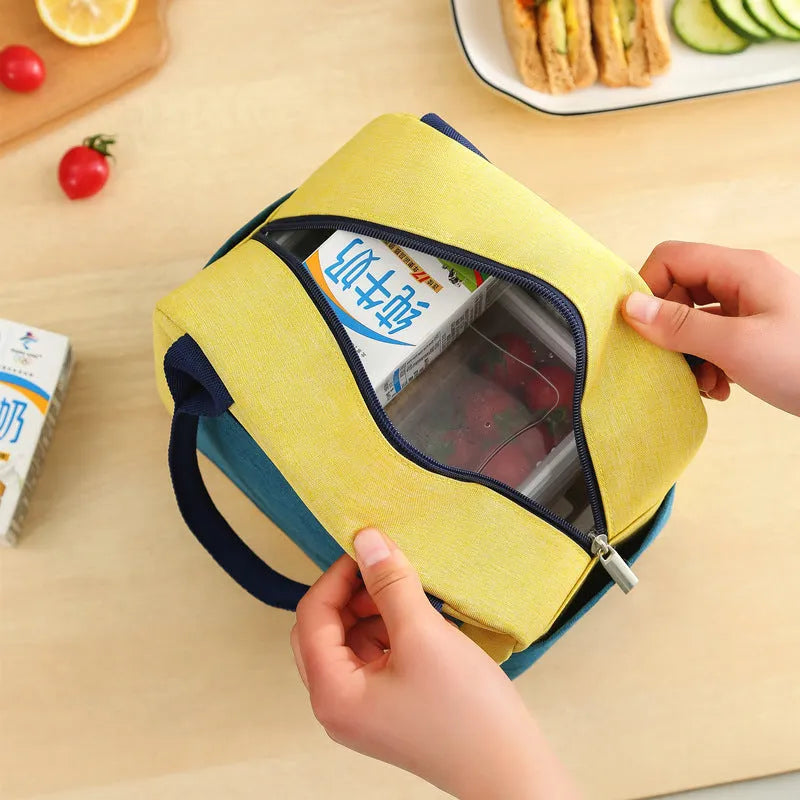 Aluminium foil laminated multi-purpose lunch insulation bag constructed from waterproof Oxford cloth with modern simplicity styling available in blue, pink, yellow green and green beige colour options for travel, work and daily food storage needs