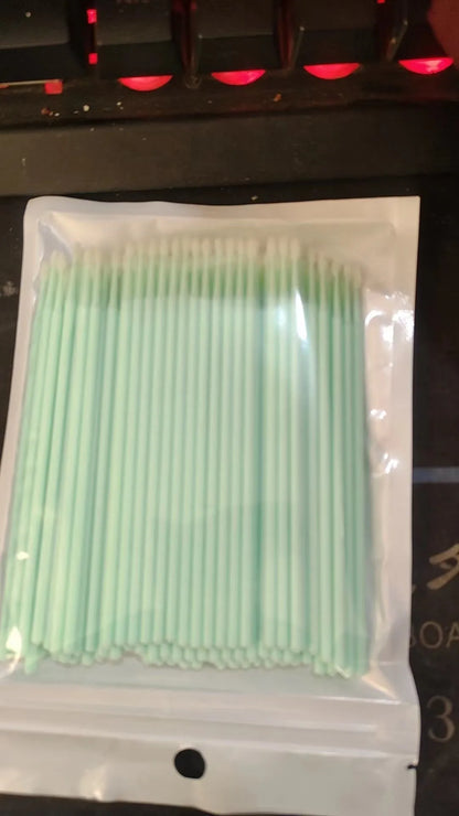 Disposable micro applicator brushes with coloured plastic handles and bendable cotton swab tips