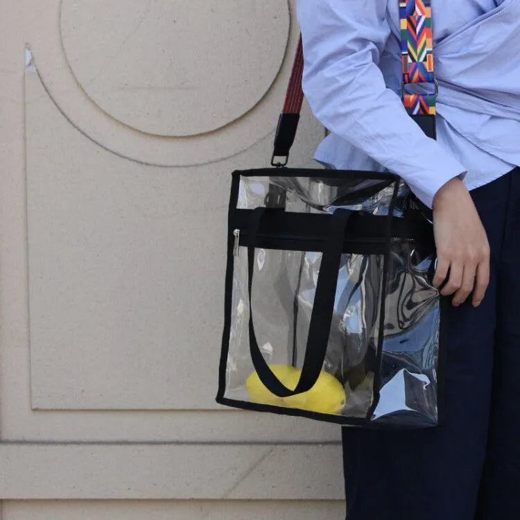 Clear PVC women's messenger bag with a coloured front panel and double shoulder straps.