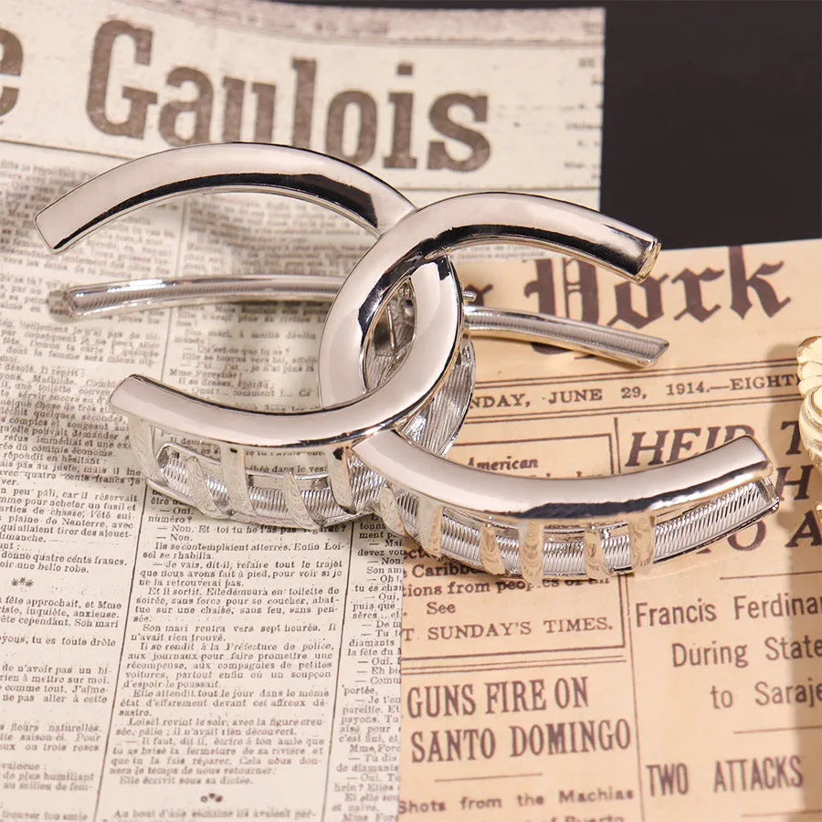 Silver metal hair claw barrette example from a range of 44 Korean-style designs.