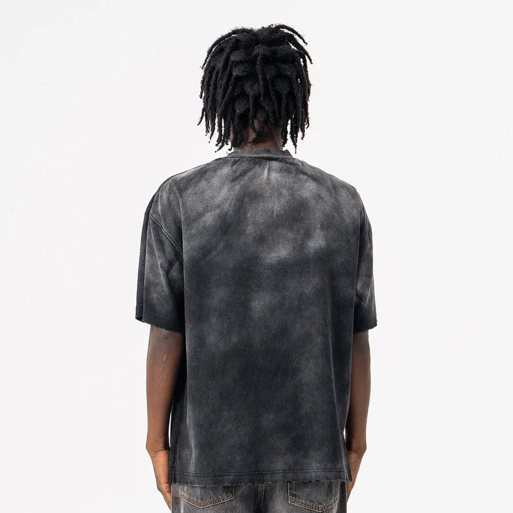 Black men's loose fit cotton t-shirt with letter print and drop-shoulder short sleeves on a hanger.