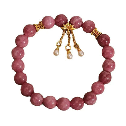 Pink lotus tassel natural stone bracelet with pearl pendant and flower charm.
