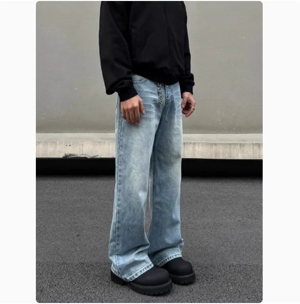 Men's blue straight leg jeans with whisker distressing and flared leg cut