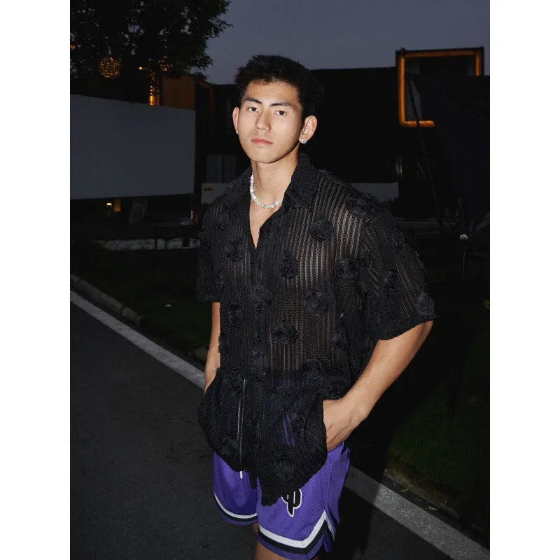 Men's loose fit floral print short sleeve shirt in black with a wool lining, shown on a mannequin.