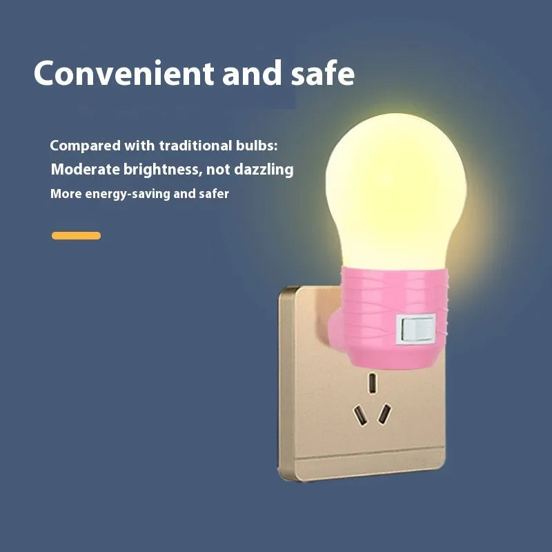 Plug-in bedside baby night light in white, blue, or pink shell with round shape.